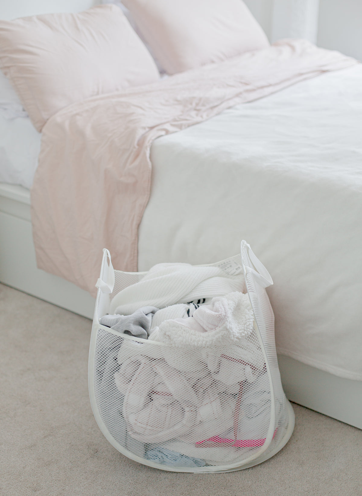 Plus size clothing care tip with a mesh laundry basket filled with clean clothes