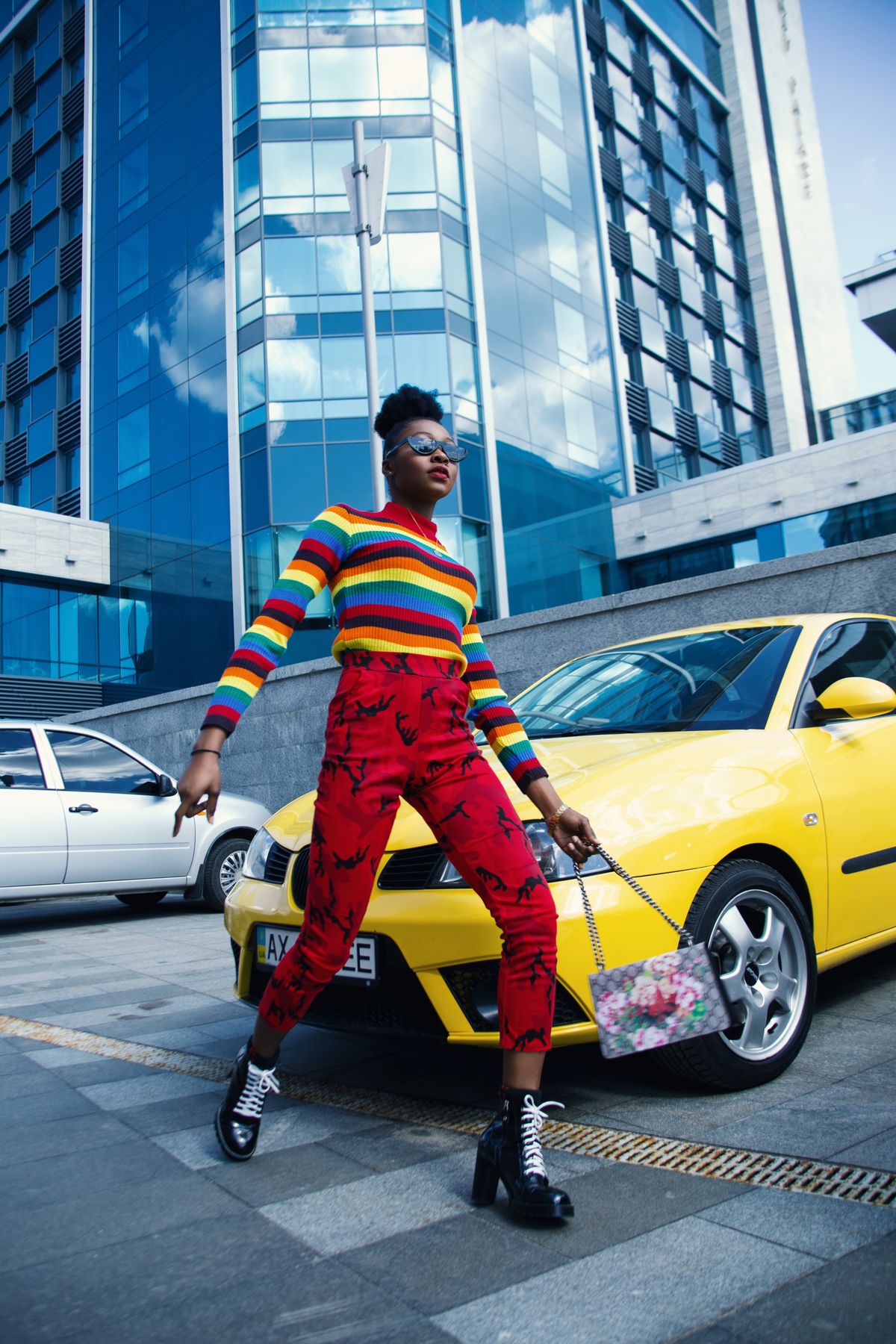 Plus size color block separates in a rainbow knit and bright red trousers