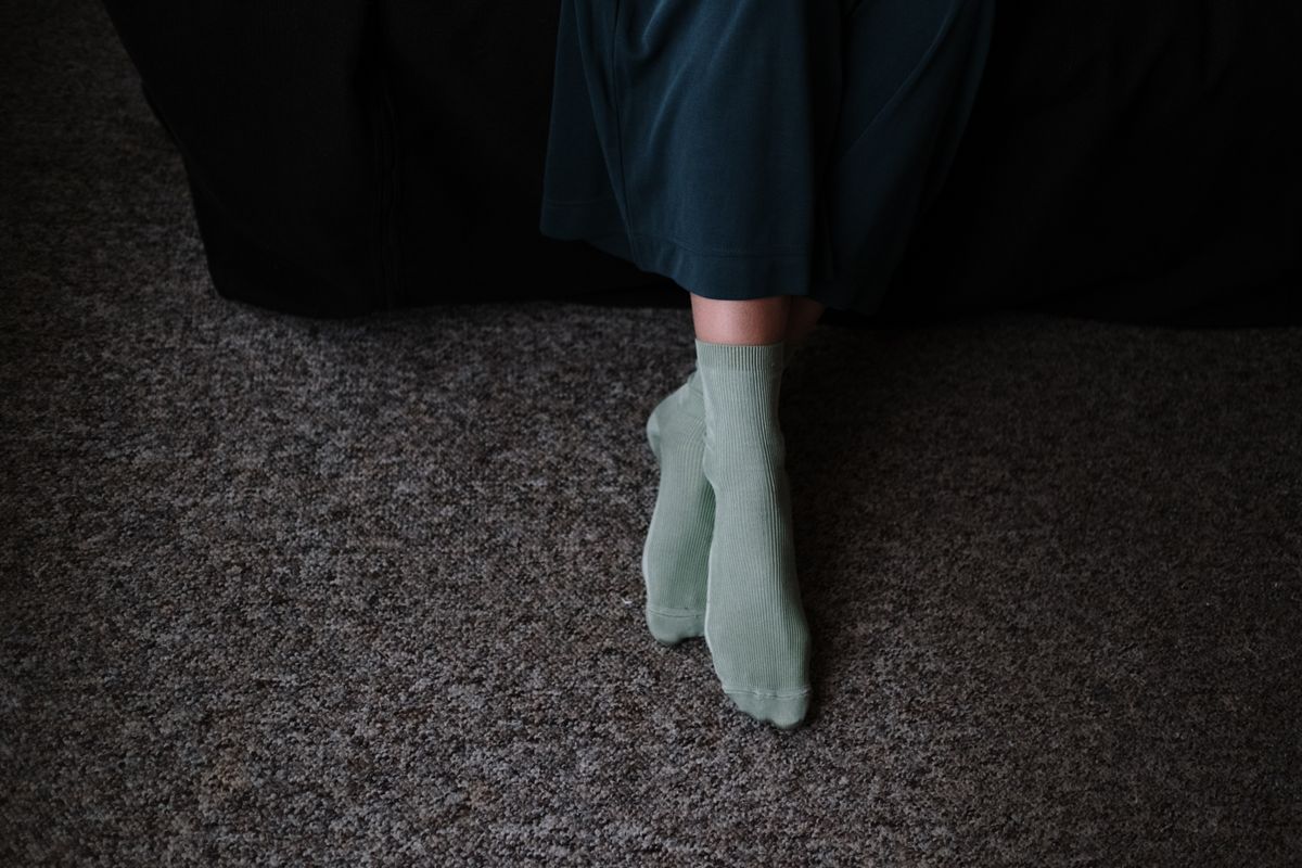 Plus size grip socks for cozy days with soft ribbed socks on a carpet at home